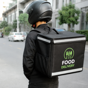 Insulated food delivery bag carried by a rider on a city route