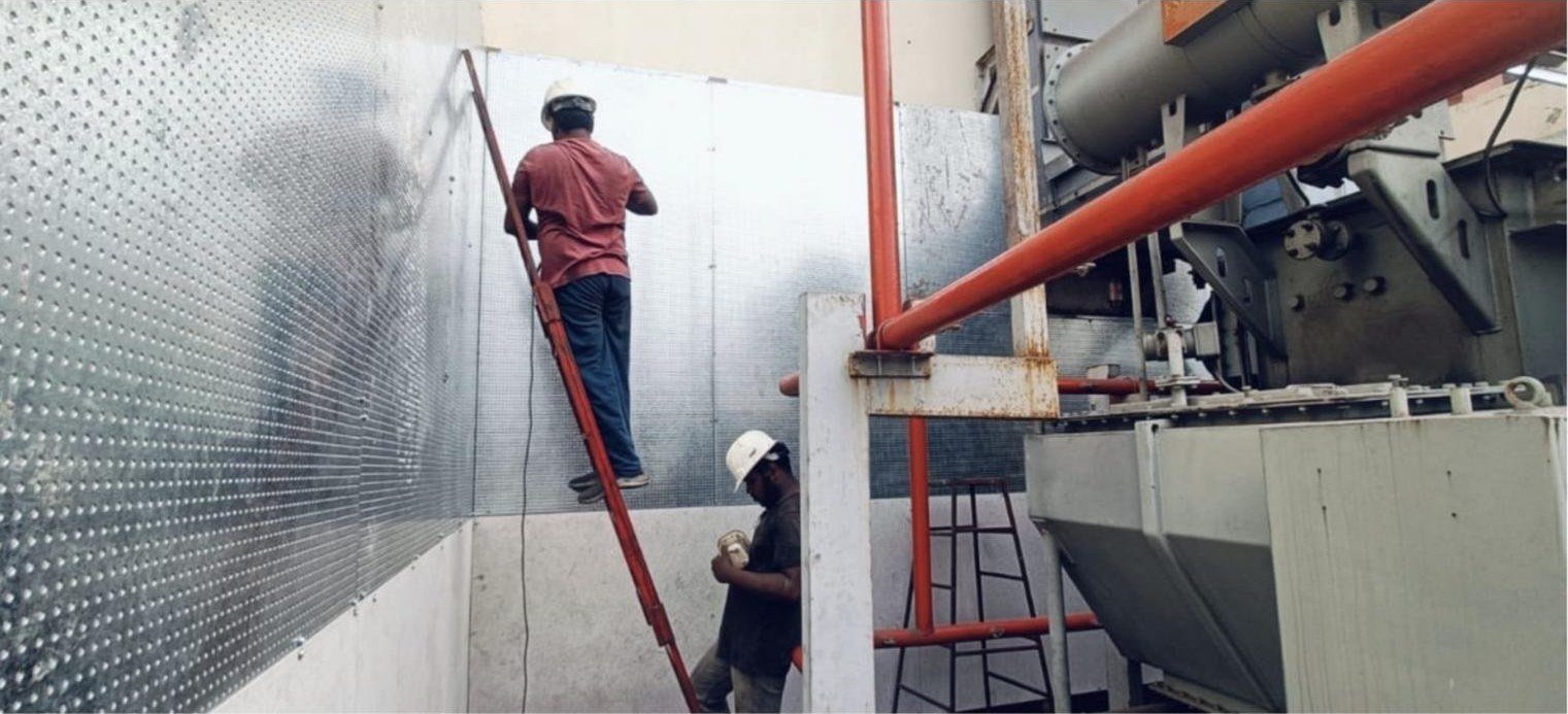 Installation of a fire and blast proof wall — WedgeSCB steel composite boards being fixed to steel framing beside a power transformer