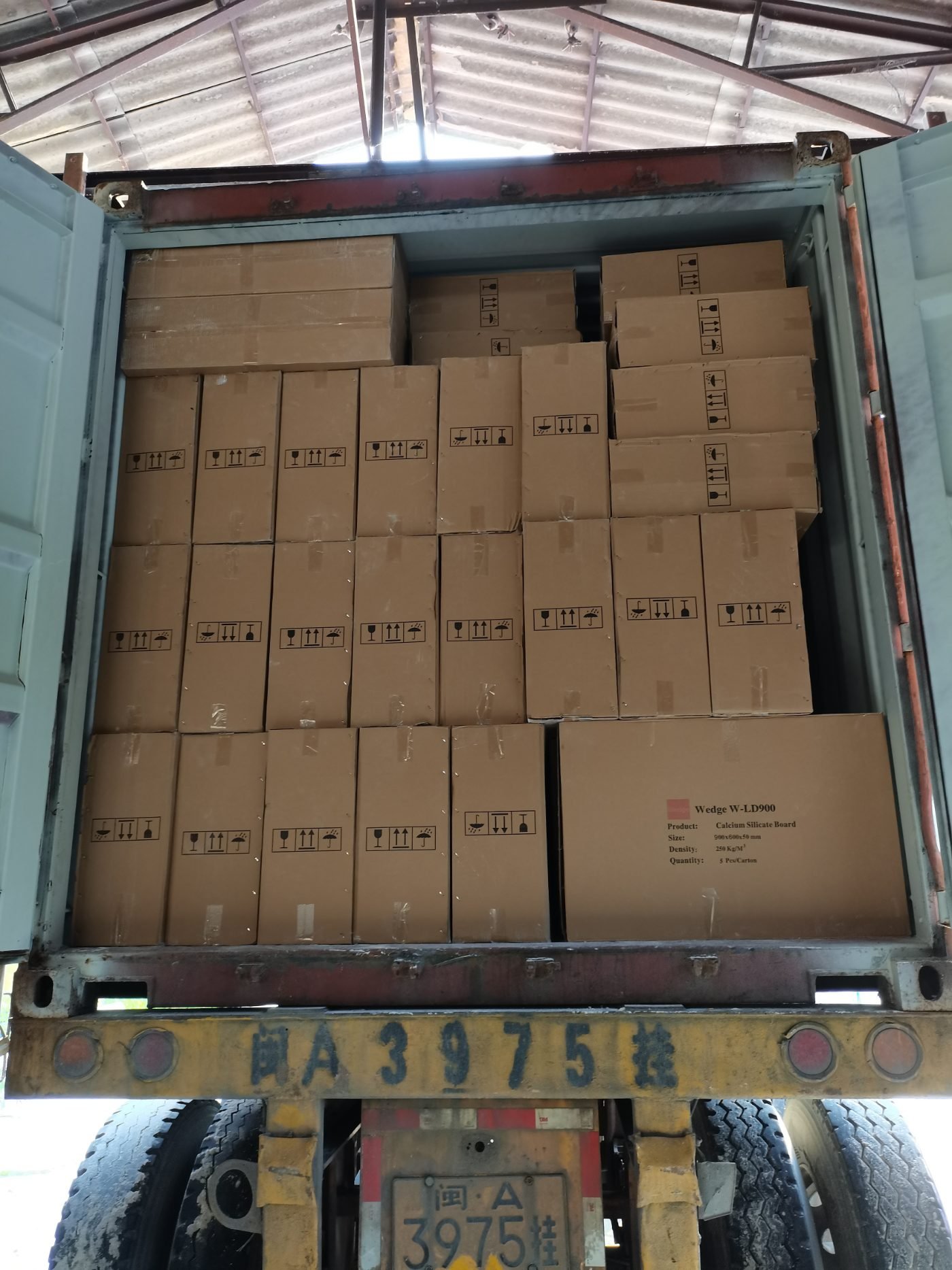 Calcium silicate board cartons loaded into a shipping container for export