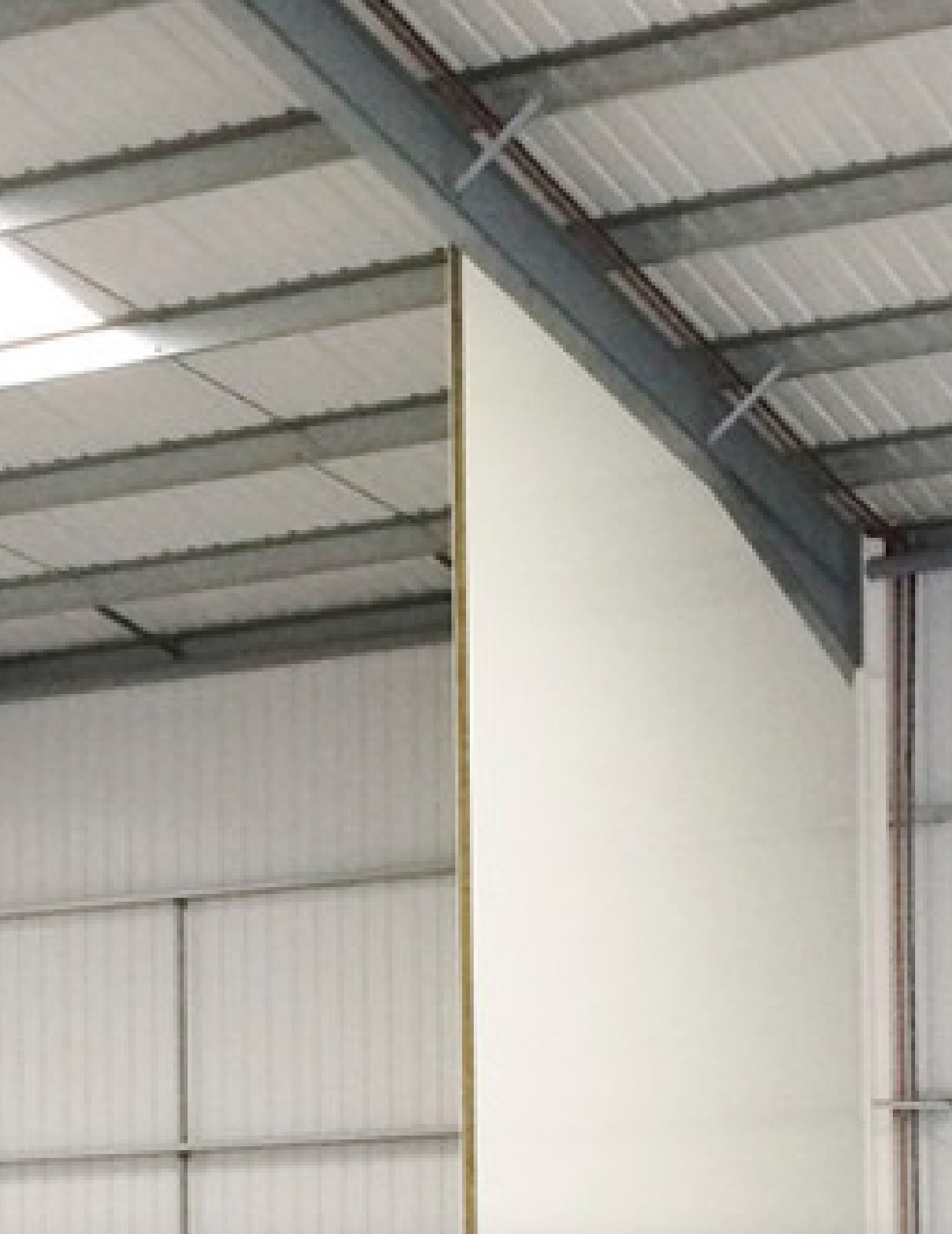 Fire wall and partition built with calcium silicate boards to the roof deck