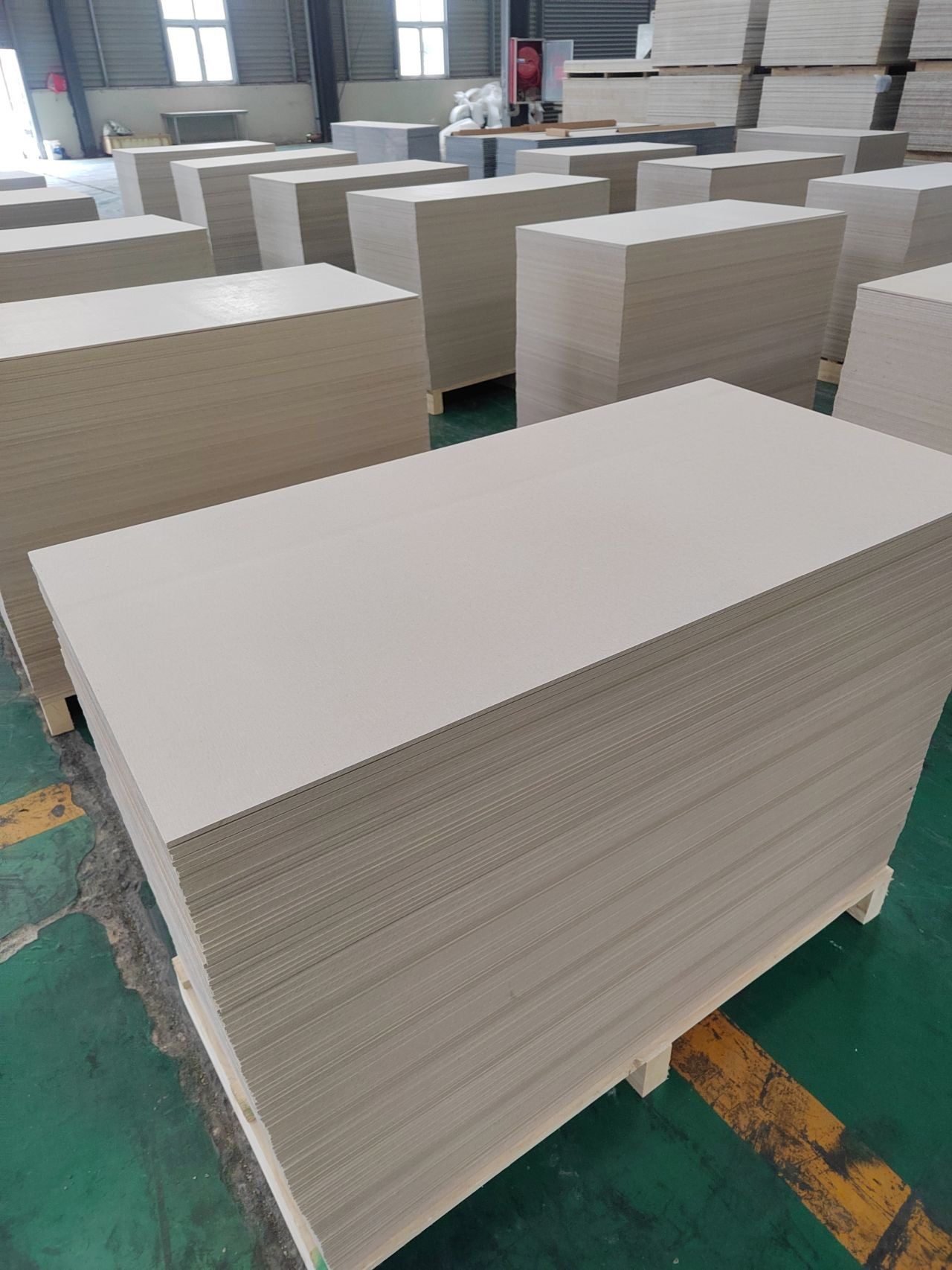 Calcium silicate board stacks on pallets at the Wedge Industries production line
