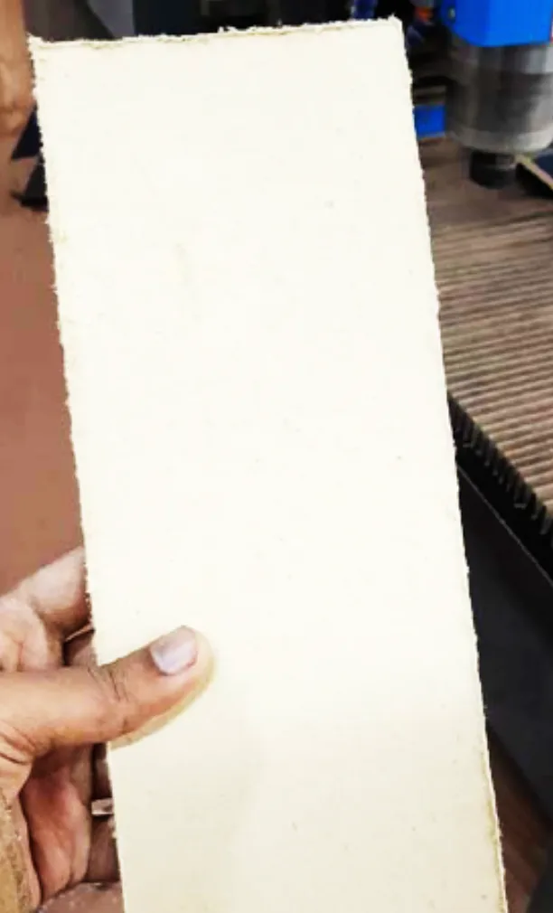 Machined strip of high strength insulation board at the CNC cutting table