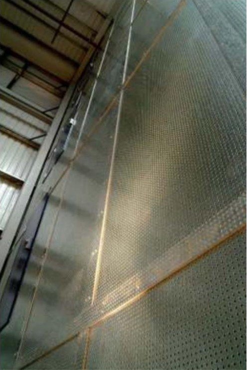 Close-up of perforated galvanised steel composite board fire wall panels on steel framing