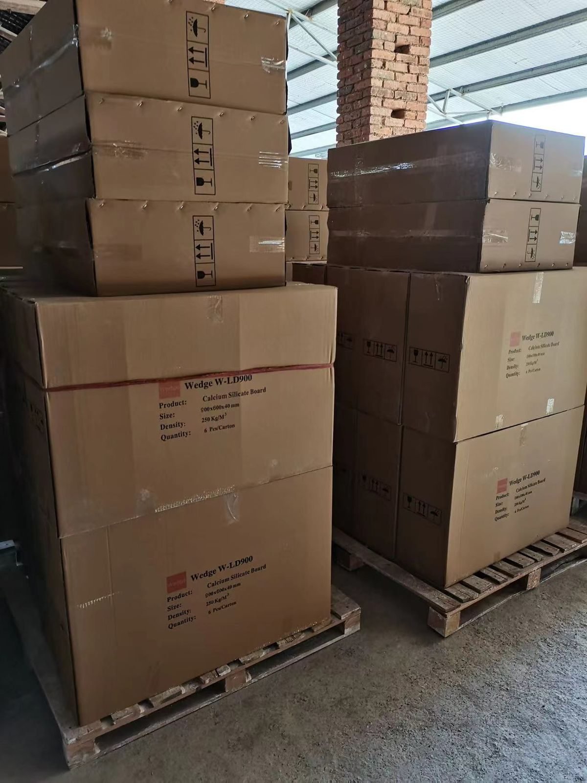 Wedge W-LD900 calcium silicate board cartons stacked on pallets ready for dispatch in India